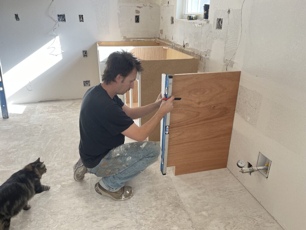 jake installing kitchen cabinets